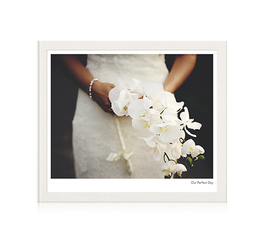 Large Classic wedding photo album with bride on the cover.