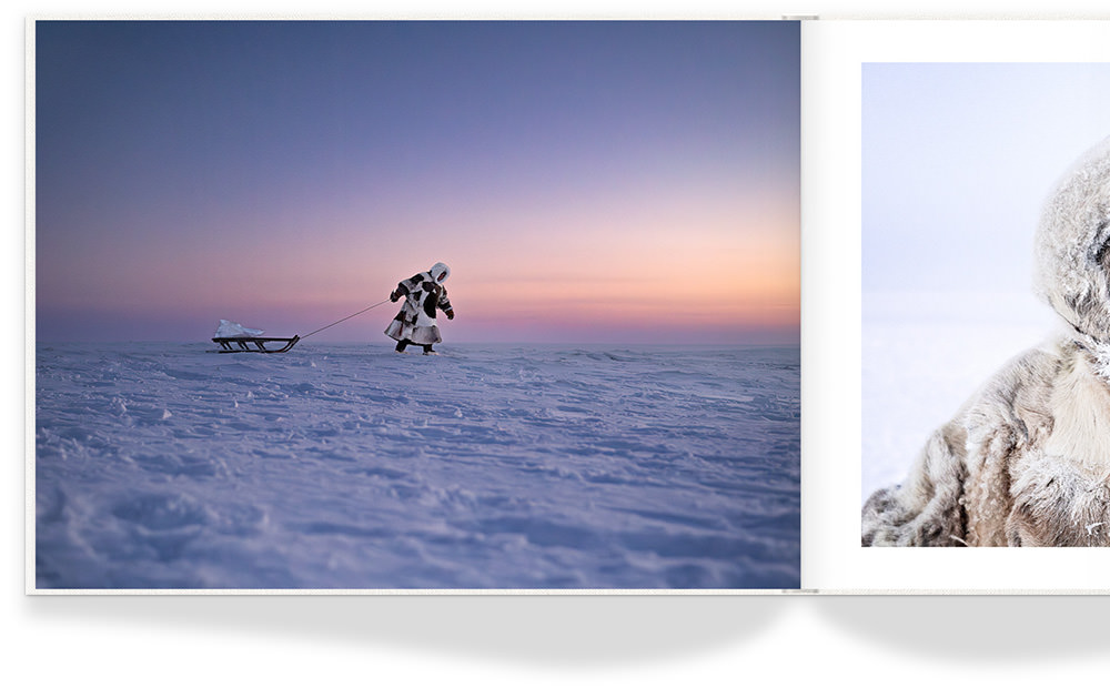 Landscape Photo Album with photo of eskimo pulling sled on icy snow floor