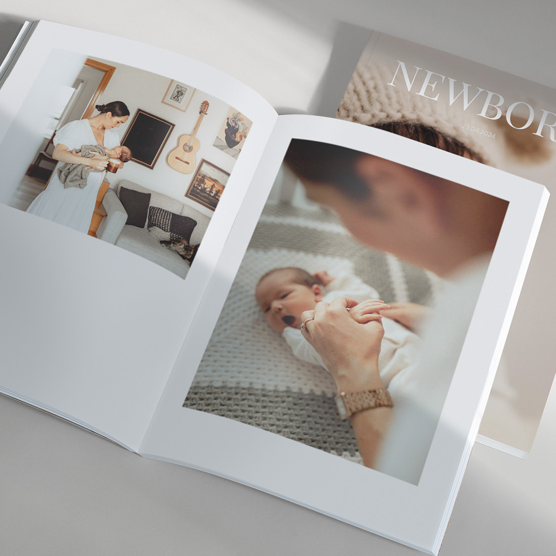 Open Baby Magazine showing spread of baby photos
