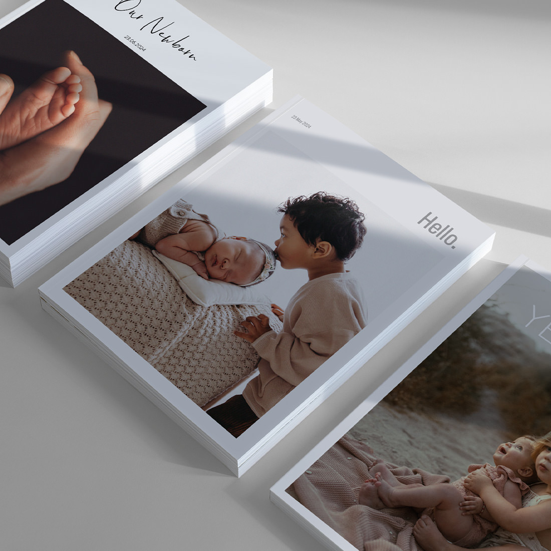 Three Baby Magazines laying side by side to show cover designs