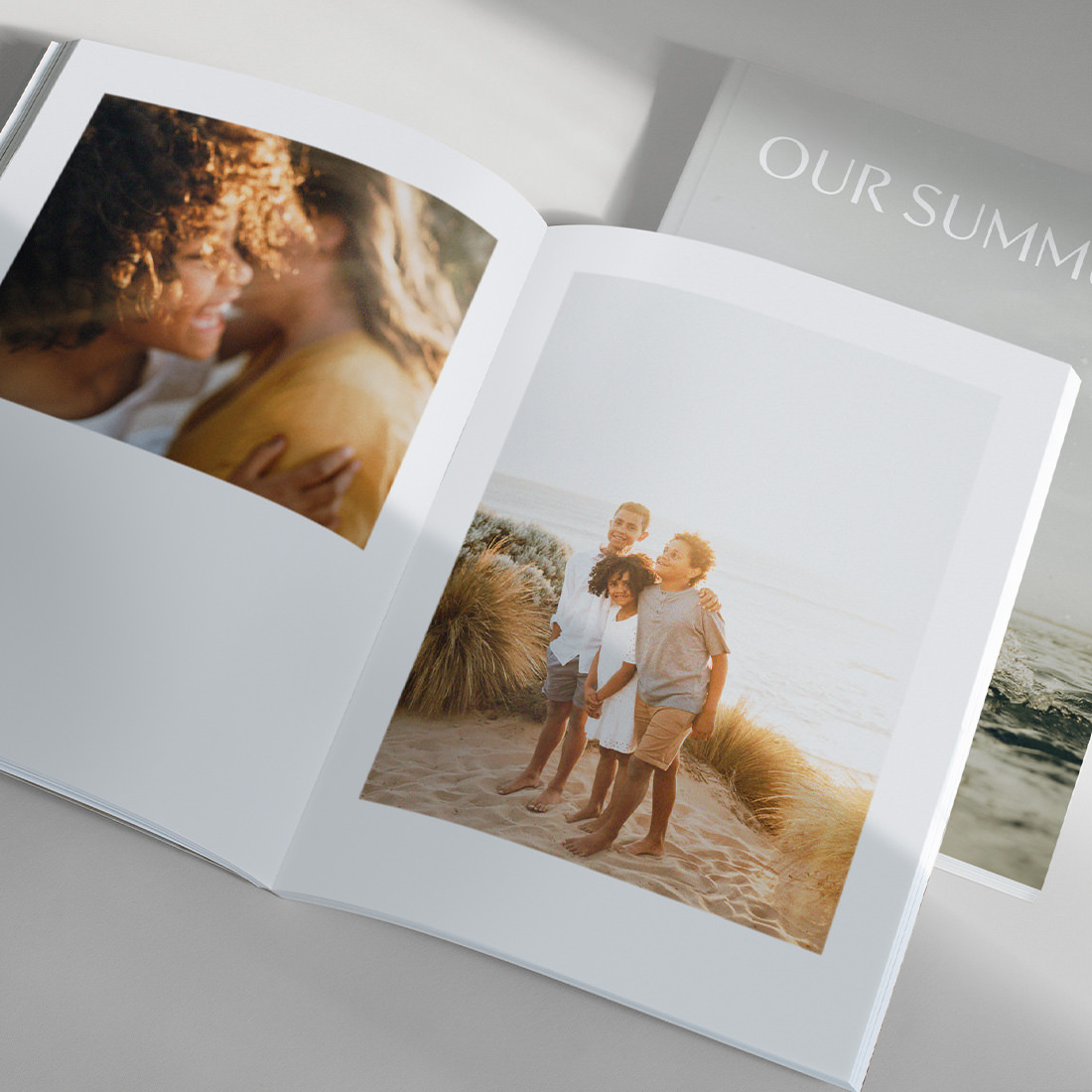 Open Family Magazine showing spread of family photos