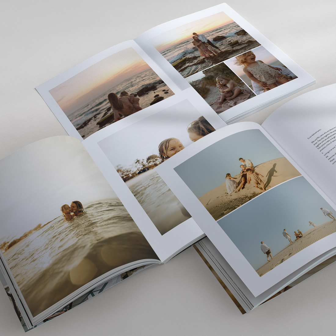 Three open Family Magazines displaying Designer Layouts on spreads