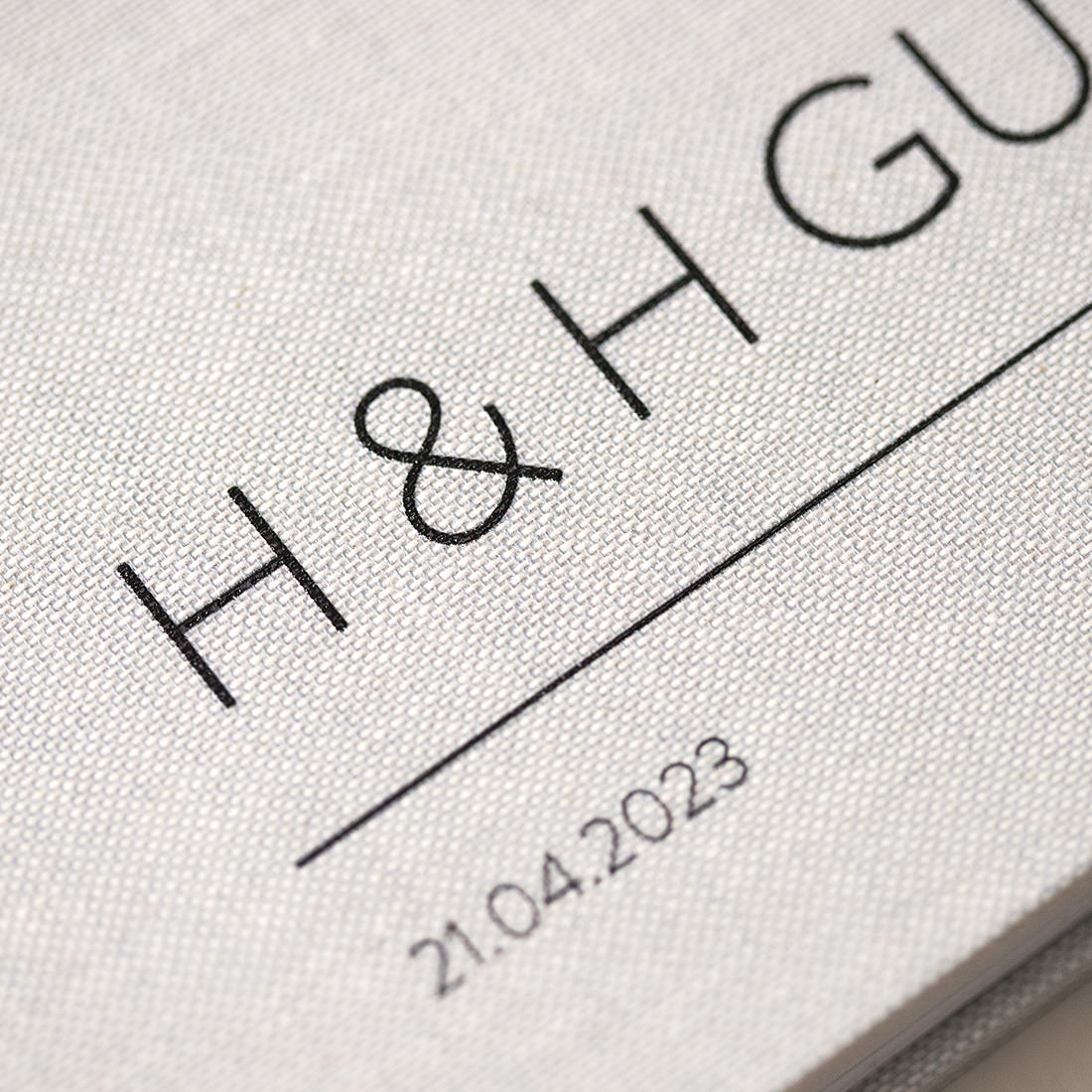 Close up of UVP writing printed on cover of wedding guest book.