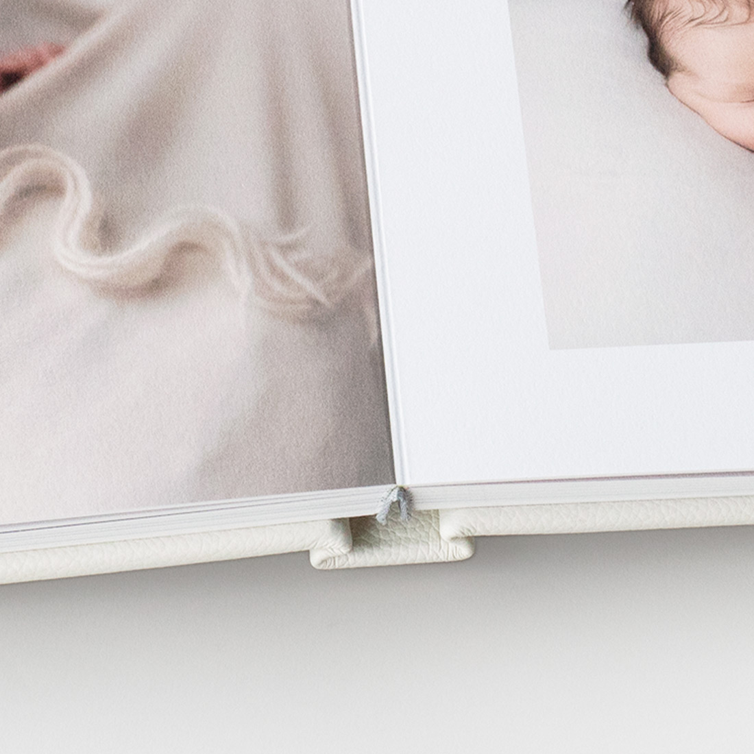 Leather Photo Album close-up of lay-flat binding on white table