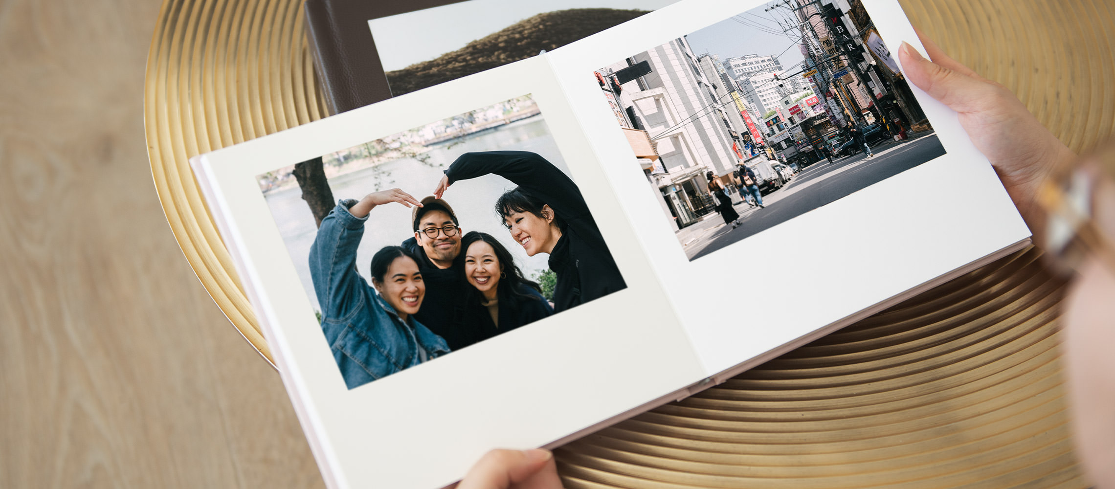 Open square photo album of two older woman best friends together in Korea