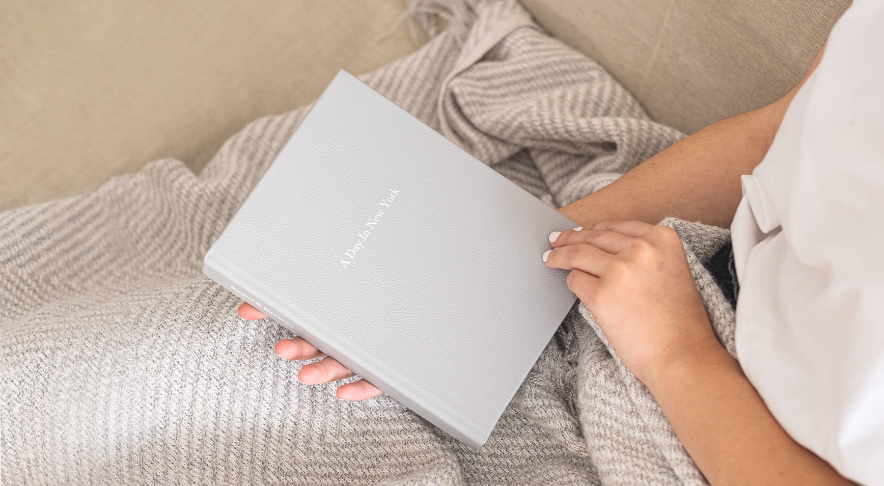 Woman holding medium premium photo album