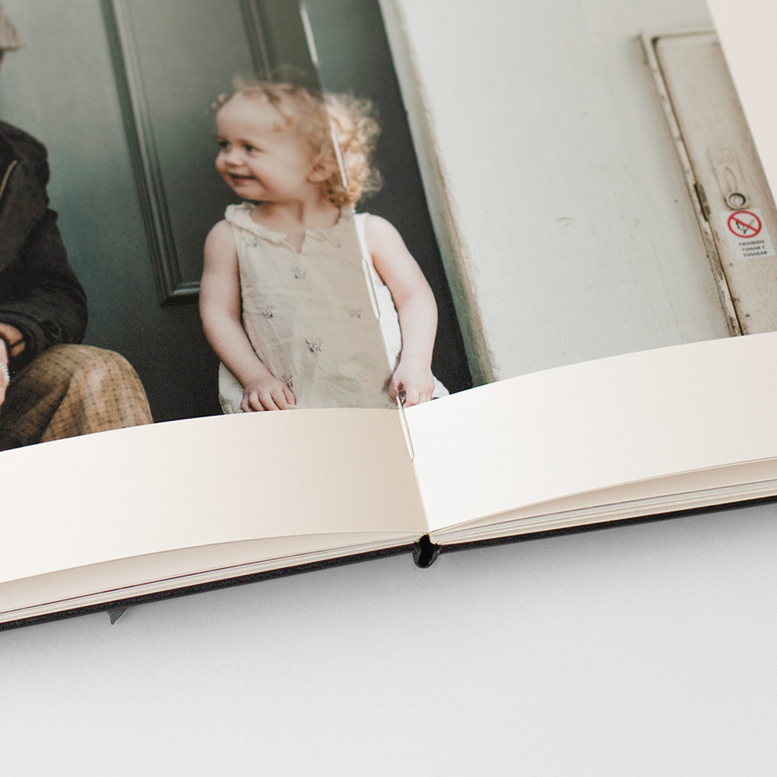Close up of stitch bound Moleskine Photo Book spread